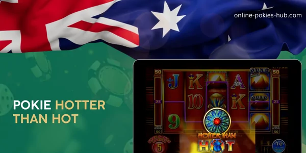 monitor with pokie hotter than hot, australian flag, inscription on green playing chips and dice background